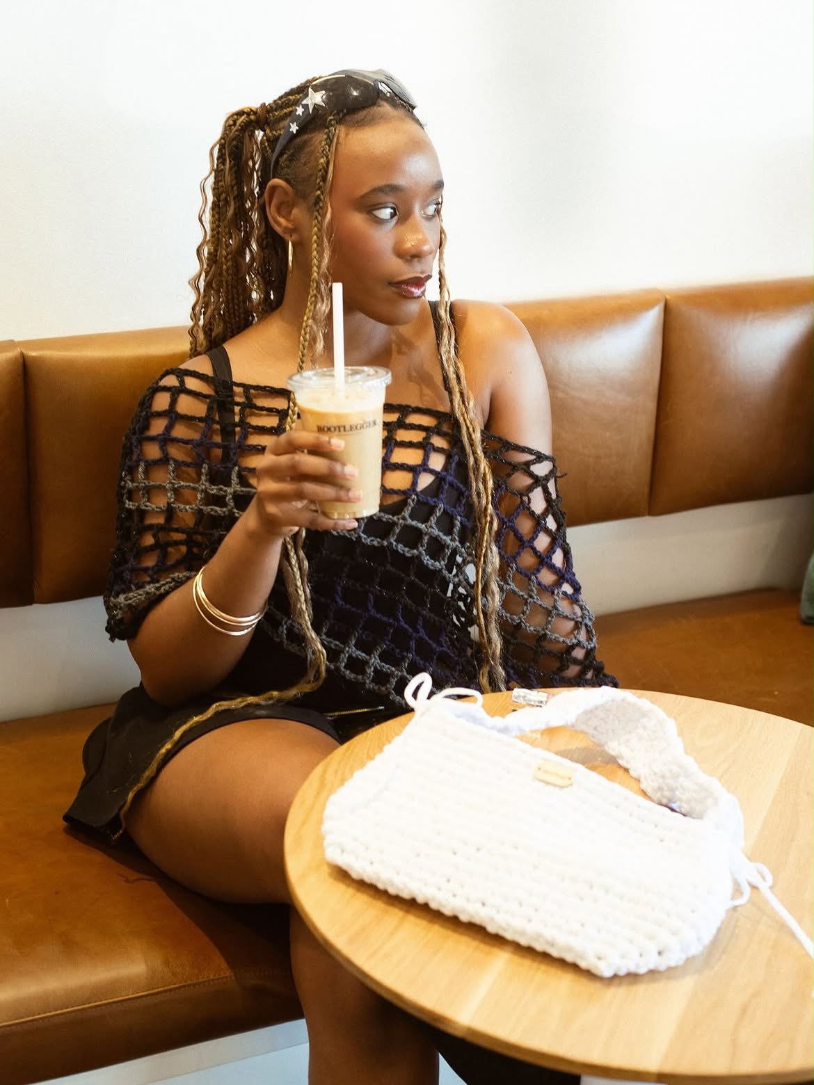 Model carrying a handmade Kafute crochet bag